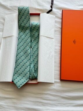 Hermes Mint Green Printed Silk Tie with sled and polar bear motif
